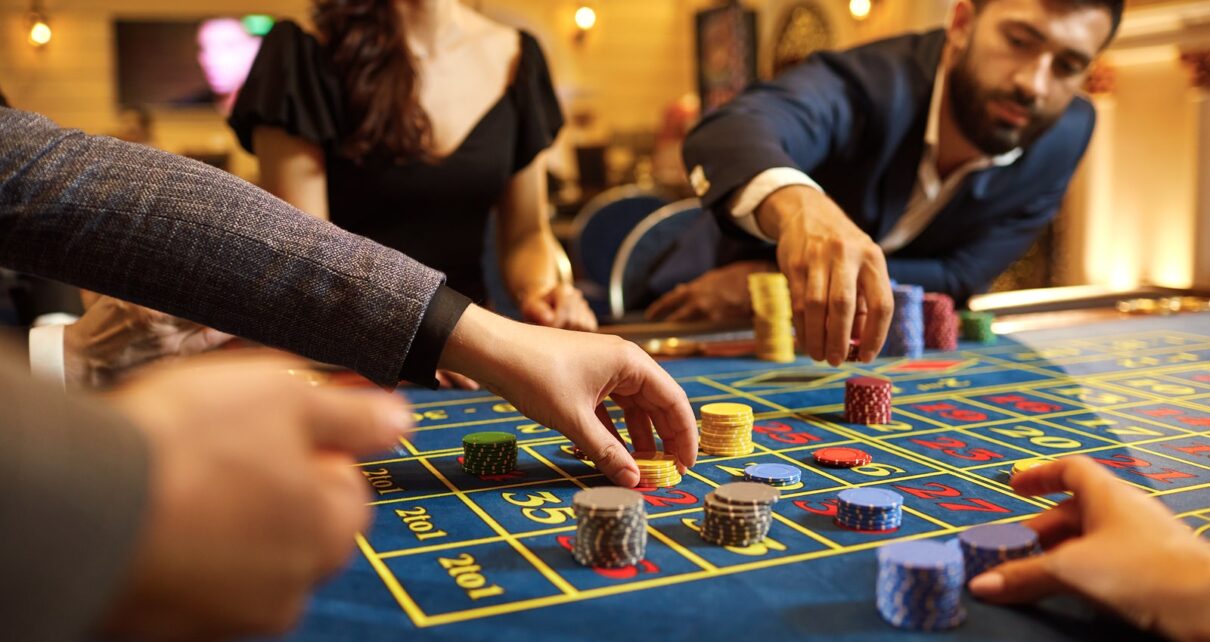 bigstock A Group Of People Gamblers Pla 330639664 min 1210x642 1